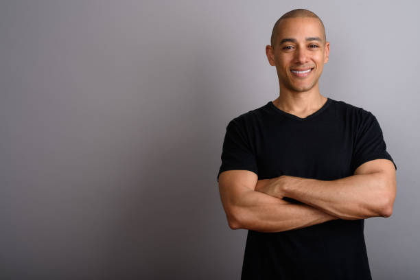 istock Studio shot of mature handsome bald man against gray background 674035742