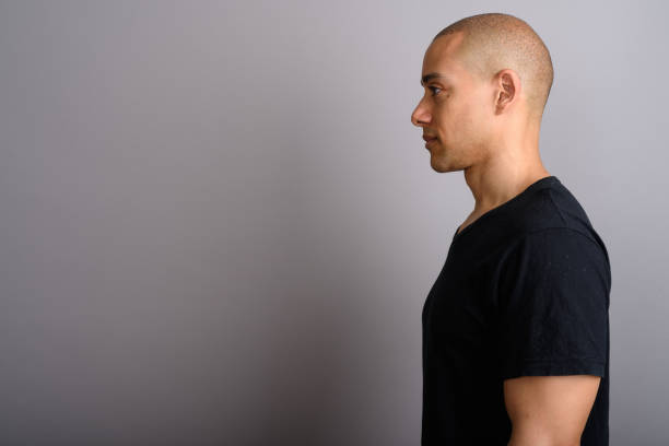 istock Studio shot of mature handsome bald man against gray background 674037978