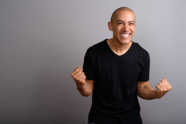 istock Studio shot of mature handsome bald man against gray background 674040758