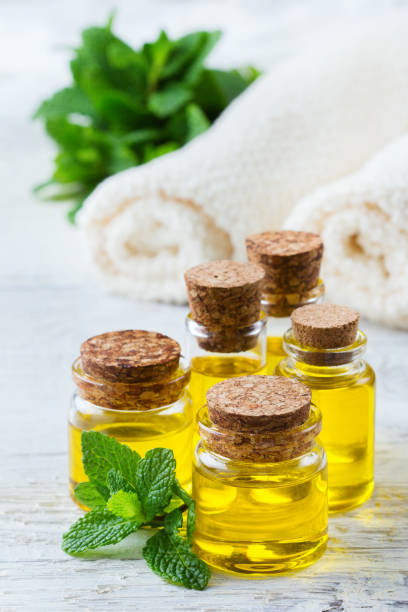 istock Organic essential mint oil with green leaves 674041242