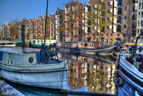 istock Canal in autumn in Amsterdam, Holland 674041330