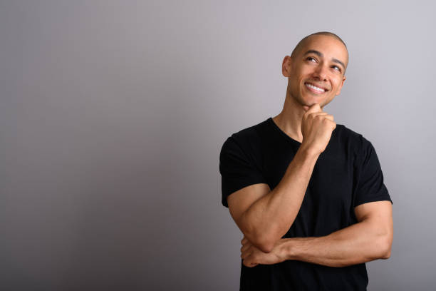 istock Studio shot of mature handsome bald man against gray background 674041666