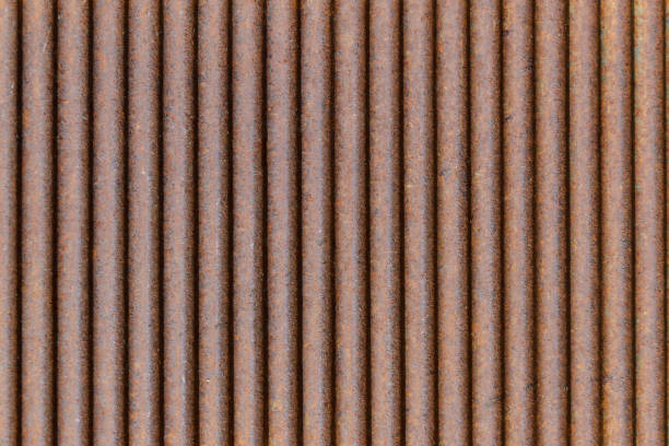 Rusted galvanized iron plate Old rusty texture of corrugated metal. Rusted galvanized iron plate corrugated galvanized metal wall surface texture stock illustrations