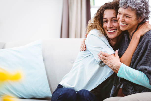istock Smiling mother and daughter hugging 674042320