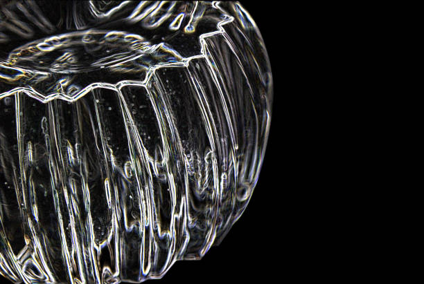 istock Transparent faceted clean glass form on a black background 674050184
