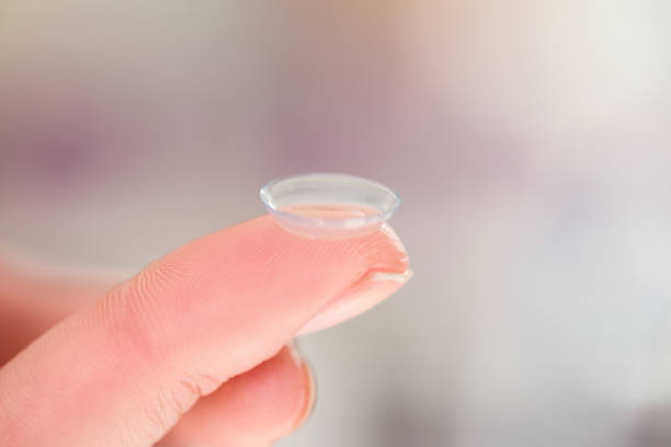 istock Cropped hand holding contact lens 674054724