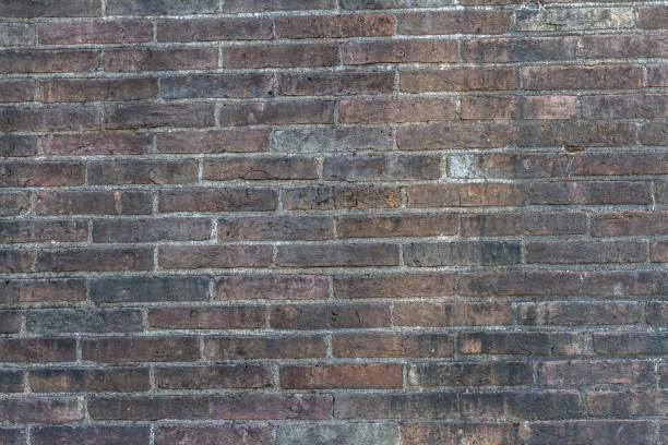 istock Old black brick abstract. Brick wall background. Grunge brick wall texture. Dark grey brick wall. Brick wall pattern 674057062