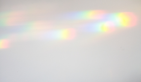 Refracted light creating colour spectrum patterns