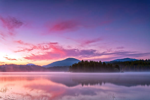 istock Early morning by the purple lake 674064028