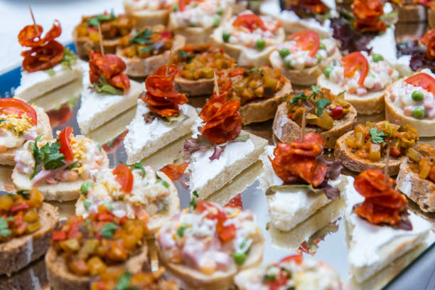 istock Colorful canape with vegetables and sausage on a slate plate 674064456