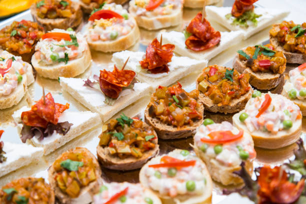 istock Colorful canape with vegetables and sausage on a slate plate 674064468