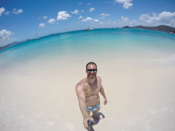 istock Man taking a selfie in Whitsunday, Australia 674085686