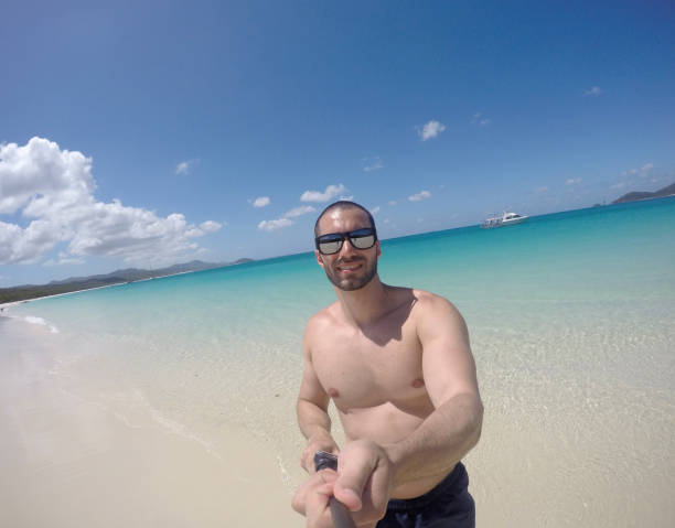 istock Man taking a selfie in Whitsunday, Australia 674086840