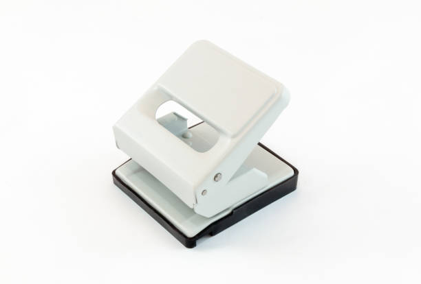istock Beige puncher with a black plastic pallet on white background 674090732