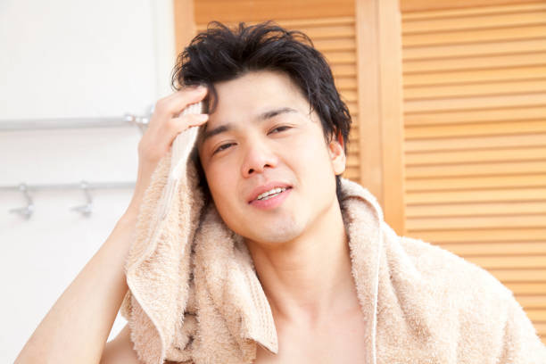 istock Wipe with a towel the hair men 674091242