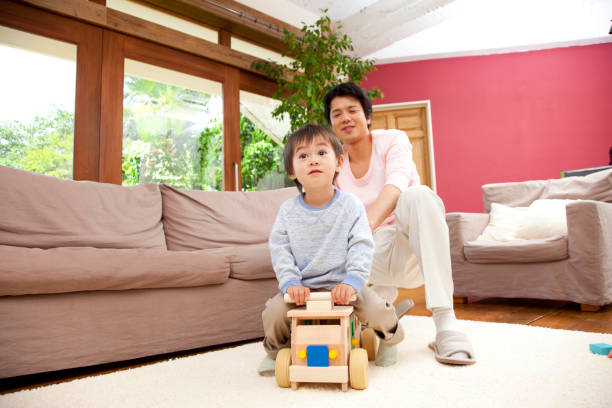 istock His father play in a wheelbarrow and son 674091486