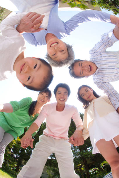 istock Three generations in a circle, laughing family 674092090