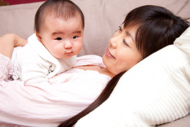 istock Mother holding baby 674092238