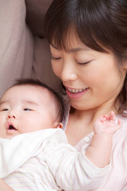 istock Mother holding baby 674094318