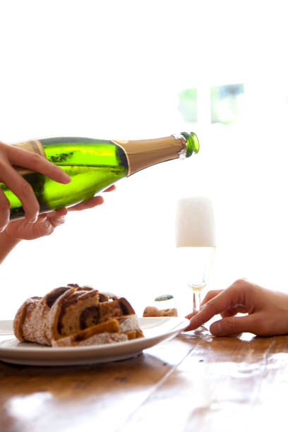 Men poured champagne in hand