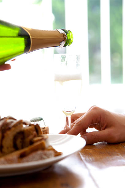 Men poured champagne in hand
