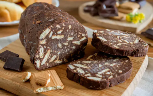 Crunchy chocolate salami with crushed biscuits and cocoa
