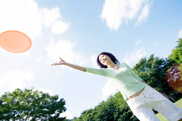 istock Women play with a frisbee 674100970