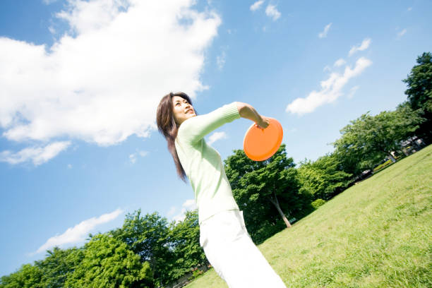 istock Women play with a frisbee 674101070
