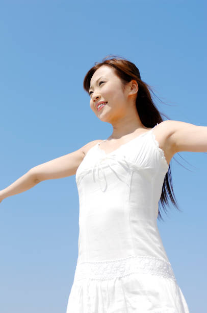 istock Women's blue sky and smiles 674101368