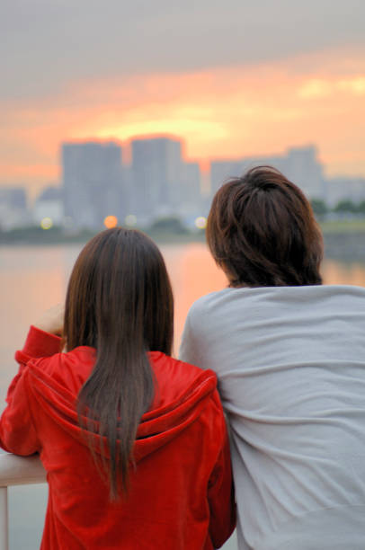 istock Rear view of a couple watching the sunset 674102302