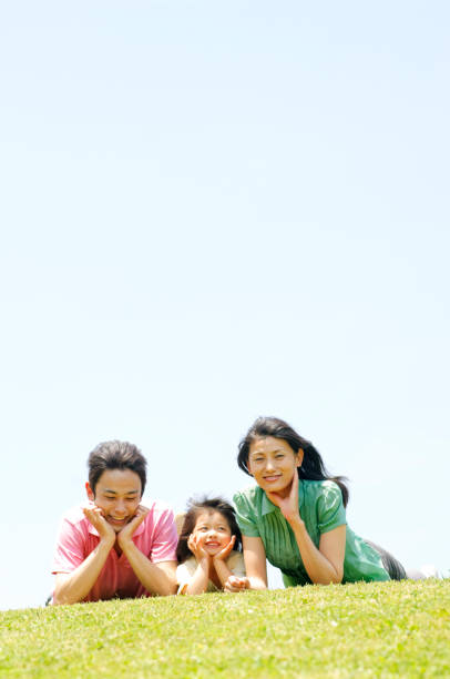 istock Lying on the grass, Chin on family 674107662