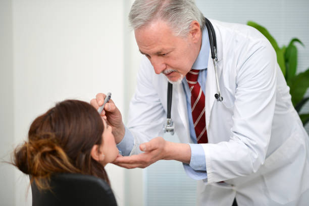 istock Doctor visiting a patient eye 674108168