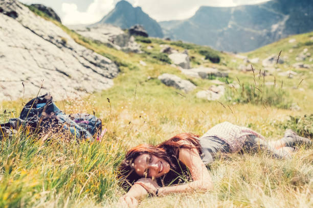 istock Young woman resting among nature 674109976