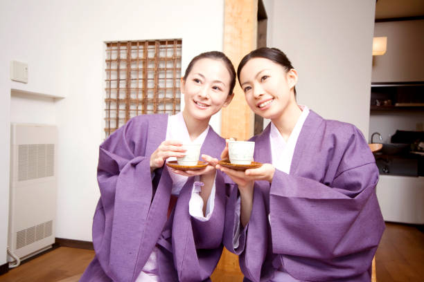 istock Two women drinking tea in a ryokan 674114204