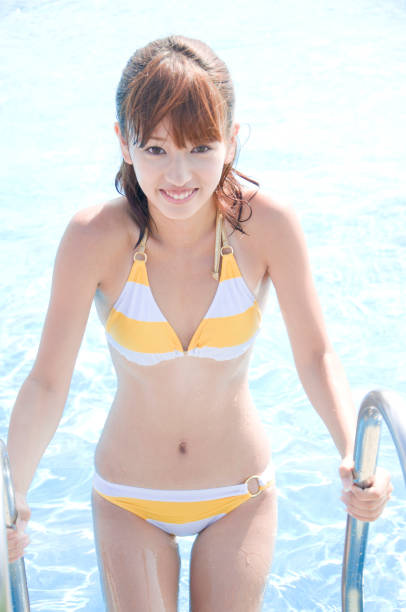 istock Swimsuit woman rises from the pool 674114612