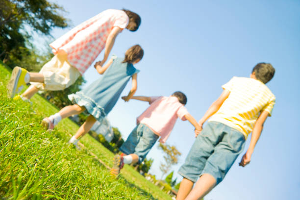 istock Family walking hand in hand from behind 674114888