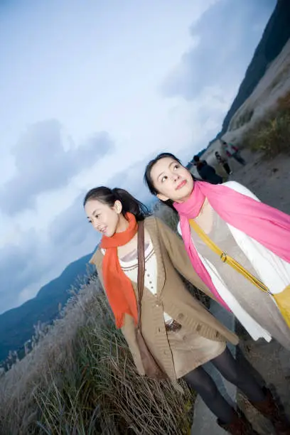 Two women walking in Susukino meadow
