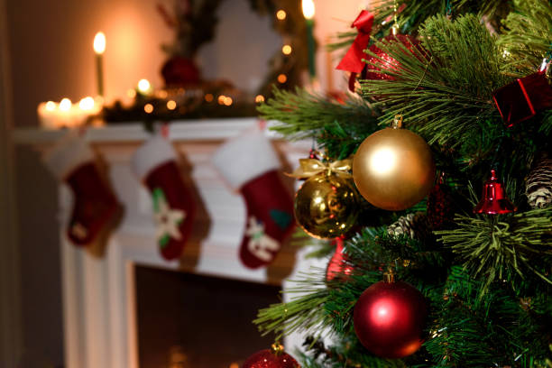istock decorated fireplace and Christmas tree at cottage 674120754
