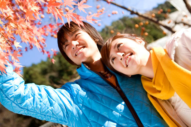 Autumn leaves and a couple