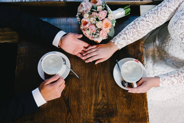 istock Wedding couple at cafe, top view 674121018