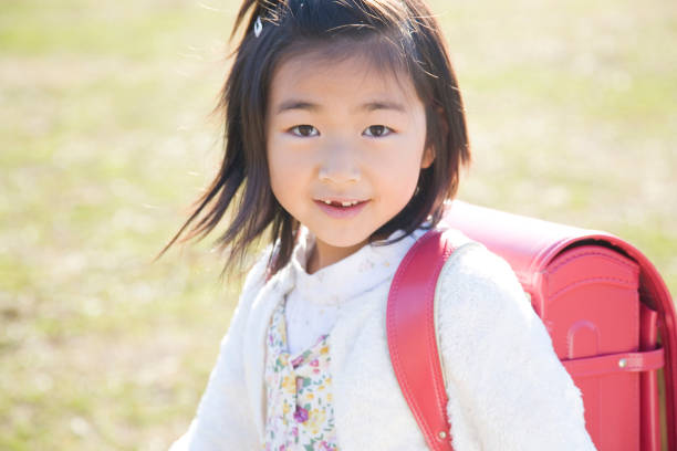istock Girl carrying bag 674122144