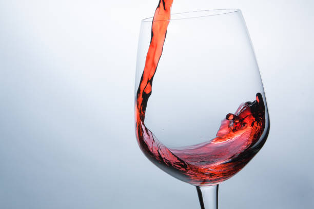istock wine being pouring into a glass closeup wine splashing splash 674123010