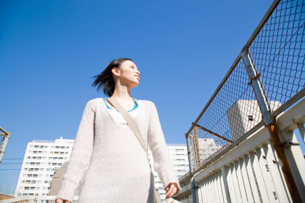 istock Woman with blue sky 674133164