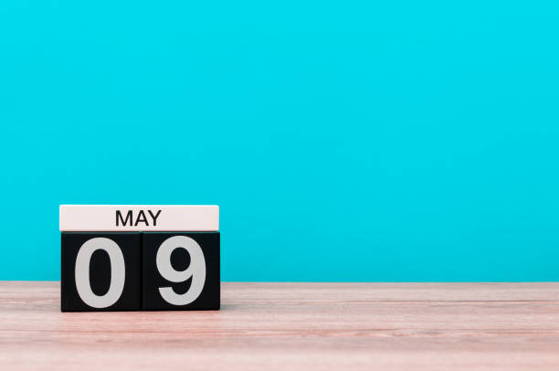 istock May 9th. Day 9 of month, calendar on turquoise background. Spring time, empty space for text. Symbols Of the victory in World War II 674138878