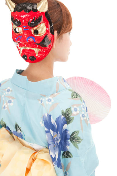 istock Yukata woman wearing a devil's head from behind 674139120