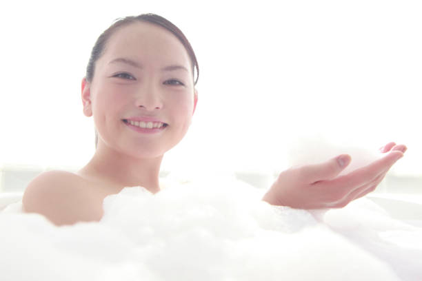 istock Women are playing in the bath bubbles 674146406