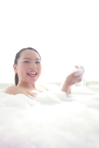 istock Women are playing in the bath bubbles 674146446