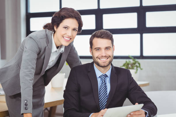 istock Confident young business people in office 674146686