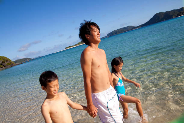 istock Father and daughter into the sea 674146802