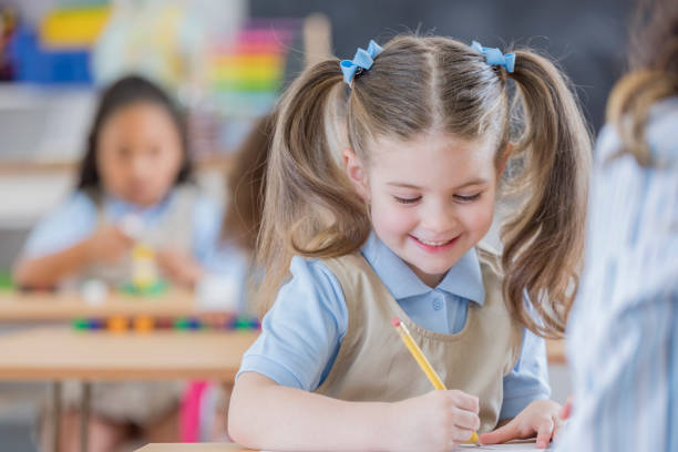 istock Cheerful kindergarten student at school 674147200
